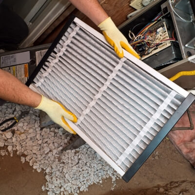 Technician Holding Air Filter